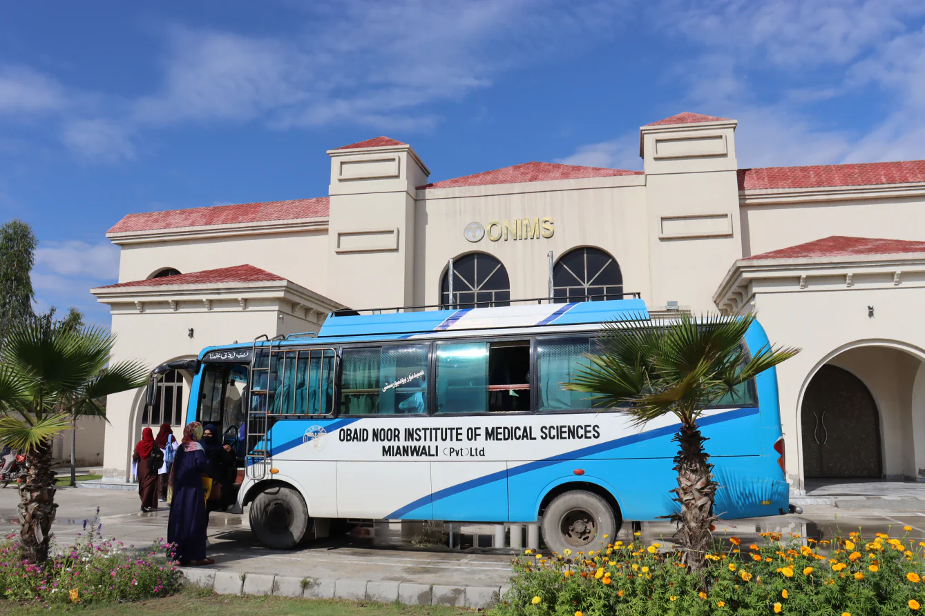 An ONIMS transport bus outside the campus