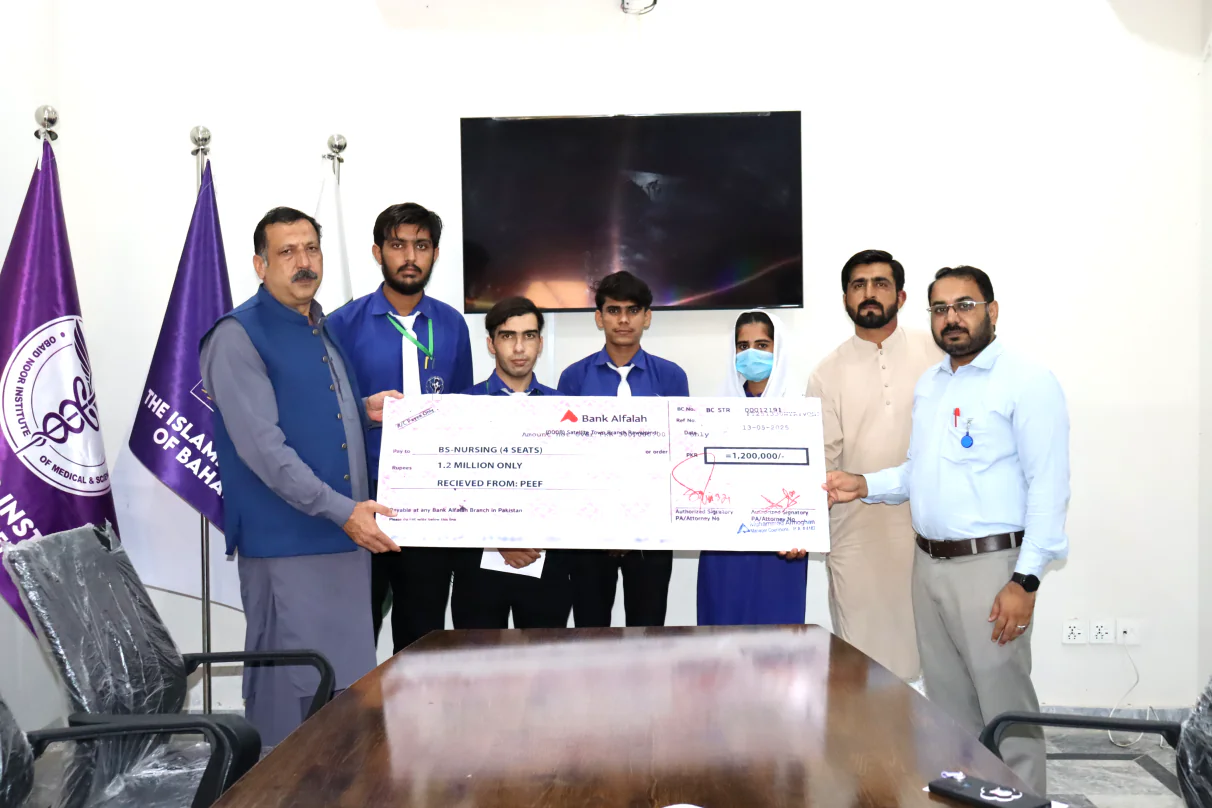 A scholarship being awarded to ONIMS students