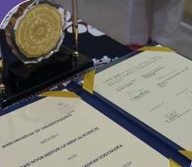 The signed Memorandum of Understanding between ONIMS and UMY